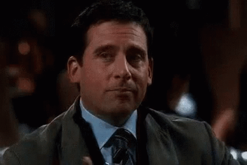 An image from The Office of a man winking to the camera