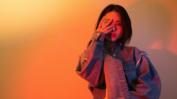 young chinese hiding her face